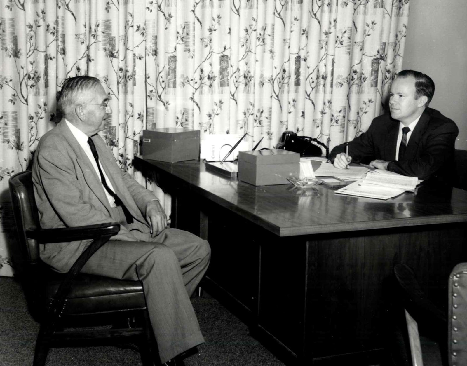 Jordan Baris meeting with a client in his Newark office, in the firm’s early years