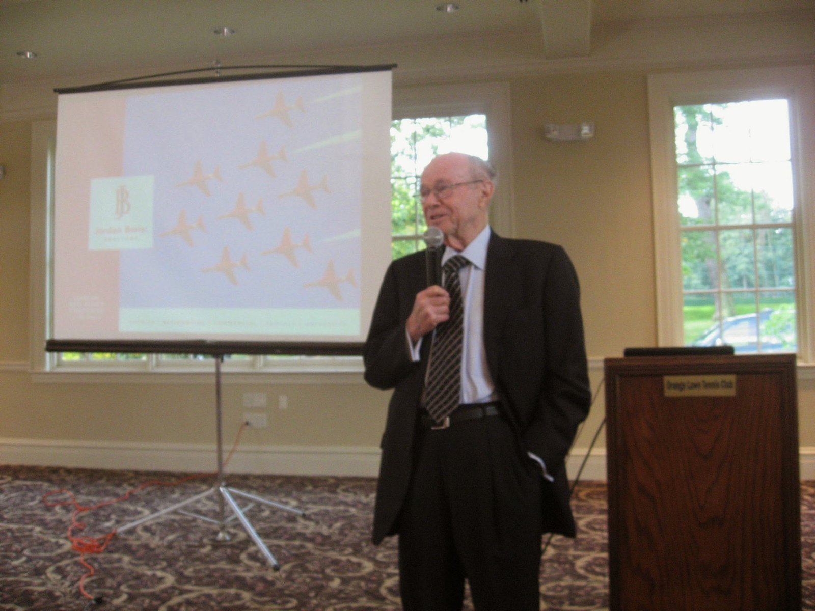 Jordan Baris presenting the firm’s next chapter to the team at the Orange Lawn Tennis Club